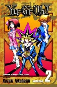 Yu-Gi-Ohin toisen osan kansikuva. Kuvassa Yuugi Mutoun "toinen persoonallisuus" (keskellä), Anzu Mazaki (vasemmalla) ja Katsuya Jounouchi (oikealla).
