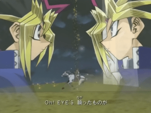 Kuva "Yu-Gi-Oh! Duel Monsters" -animen viidennestä loppuanimaatiosta. Kuvan tunnelma on voimakas: yhteinen aika on valumassa loppuun kuin tiimalasin hiekka, joten kahden toverin on kohdattava toisensa viimeistä kertaa taistelijoina. Loppukappaleena soi  Yuichi Ikuzawan kappale "Eye's".